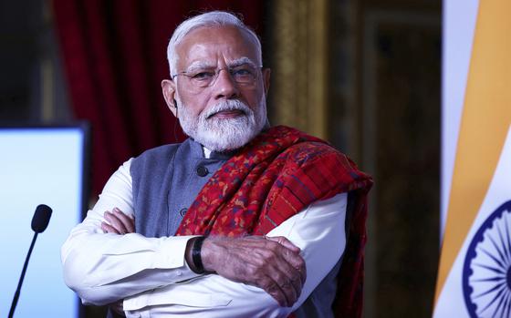 Indian Prime Minister Narendra Modi listens during the Franco-Indian Economic Forum at the Quai d’Orsay.