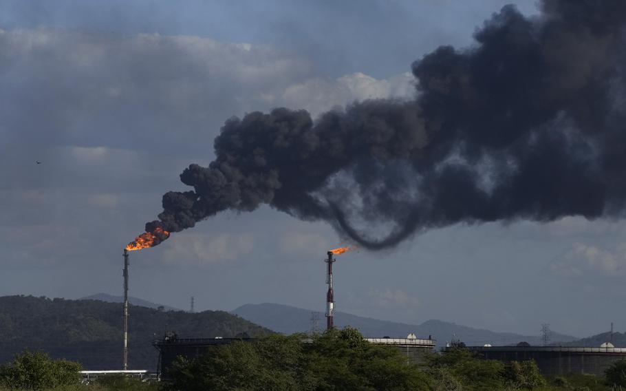 Gas is flared at the Jose Antonio Anzoategui oil complex in Barcelona