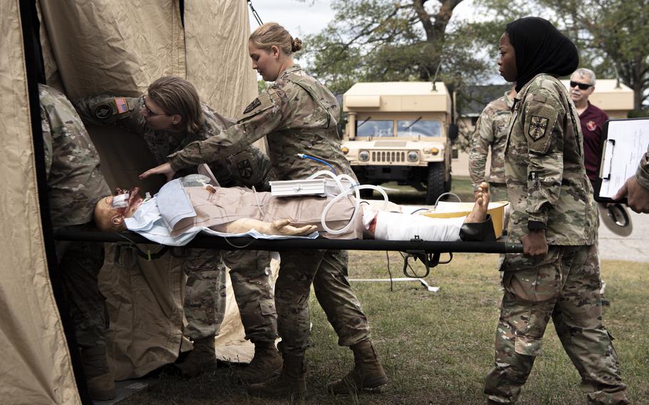 U.S. Army soldiers simulate experimental postoperative critical care at Camp Grayling, Mich. on Aug. 12, 2023, during Northern Strike 2023.