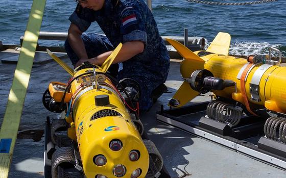 An underwater drone is prepared on a Dutch navy ship during mine countermeasure training at the Baltic Operations exercise in June 2024, which is taking place in the Baltic Sea. The U.S. Navy in Europe is working with allies on setting common operations standards for drones and emerging technology. 

