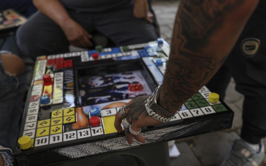 A player moves his piece in poleana during a tournament in Mexico City, Nov. 17. 