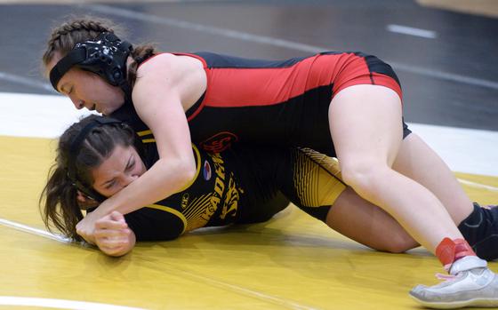 Kinnick's Audrey Snyder gains the advantage on Kadena's Emmah Strong. Snyder went on to win the title in the Rumble's 131-138-pound girls weight class.