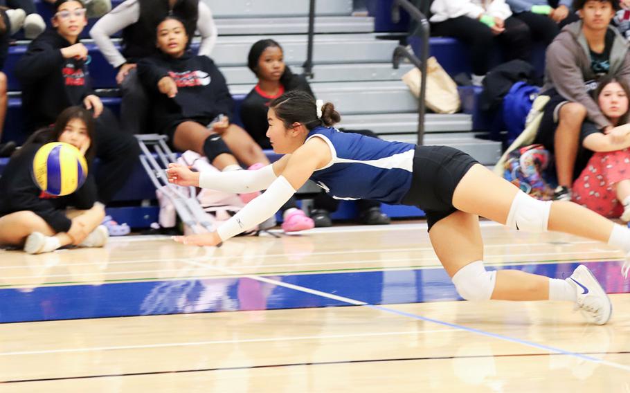 Clarice Lee leaps toward the ball.