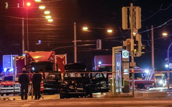 The car that was crashed into a crowd of people at the Magdeburg Christmas market is seen following the attack in Magdeburg, Germany, Saturday early morning, Dec. 21, 2024. (AP Photo/Ebrahim Noroozi)