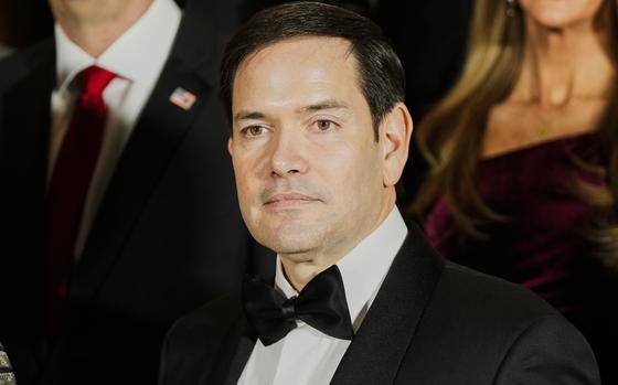 A man in a tuxedo and black bowtie.