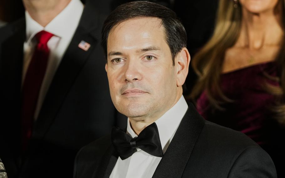 A man in a tuxedo and black bowtie.