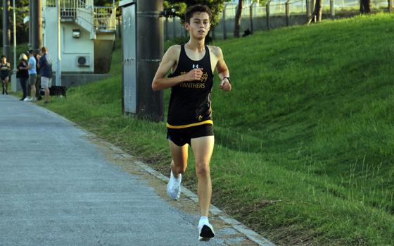 Kadena's William Rhoades heads toward the finish of Wednesday's Okinawa boys cross-country race at Camp Foster. Rhoades won with a time of 16 minutes, 49.28 seconds.