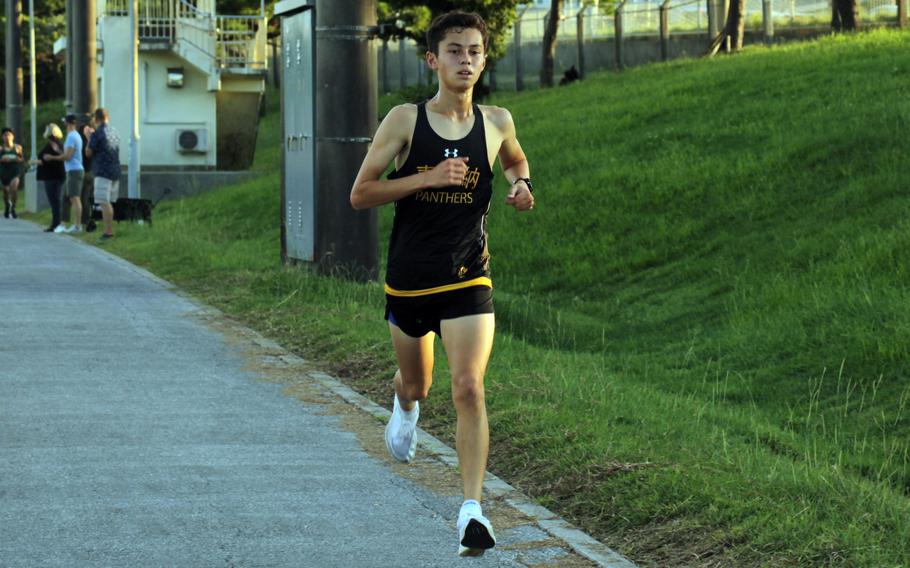 Kadena’s William Rhoades heads toward the finish of Wednesday’s Okinawa boys cross country race at Camp Foster. Rhoades won with a time of 16 minutes, 49.28 seconds.