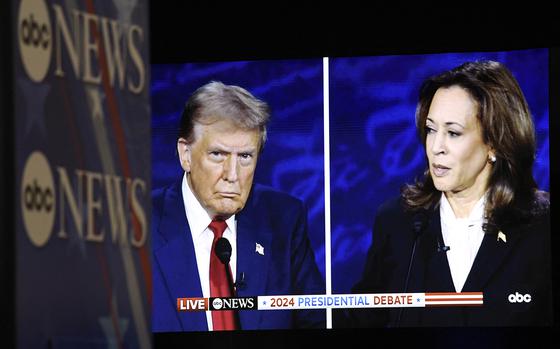 US Vice President and Democratic presidential candidate Kamala Harris and former US President and Republican presidential candidate Donald Trump are seen on a screen in the spin room as they participate in a presidential debate at the National Constitution Center in Philadelphia, Pennsylvania, on Sept. 10, 2024. (Matthew Hatcher/AFP via Getty Images/TNS)