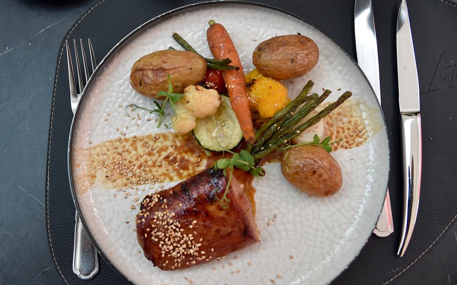 The pork fillet glazed in soy sauce was a daily special on Aug. 27, 2024, at  L'intuition in Houdeng-Aimeries, Belgium. Served with the meat was a medley of vegetables that included potatoes, cauliflower, green beans, tomato, radish and a carrot.