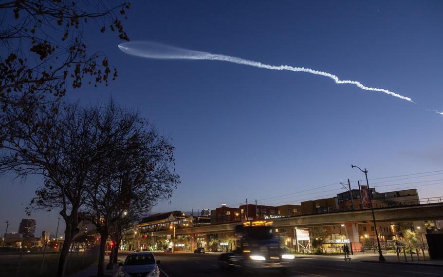 A SpaceX Falcon 9 rocket launches from Vandenberg Space Force Base on March 18, 2024, as seen from downtown Los Angeles.