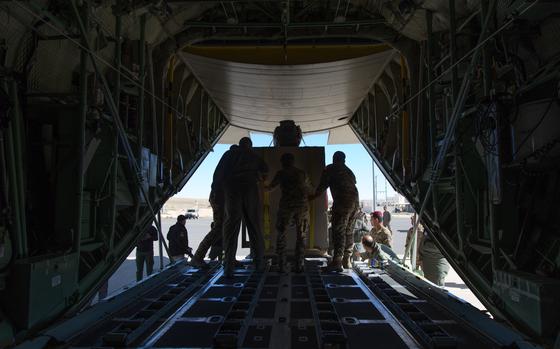 Jordanian Air Force members ensure the container is correctly ...