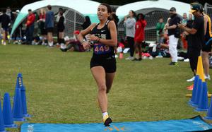 Humphreys sophomore Cassandra Jarzabek crosses the finish line the winner of the Far East Division I and the API girls race titles.