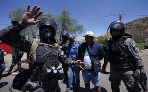 Supporters of former President Evo Morales being detained by police, in Parotani, Bolivia, Nov. 1, 2024.