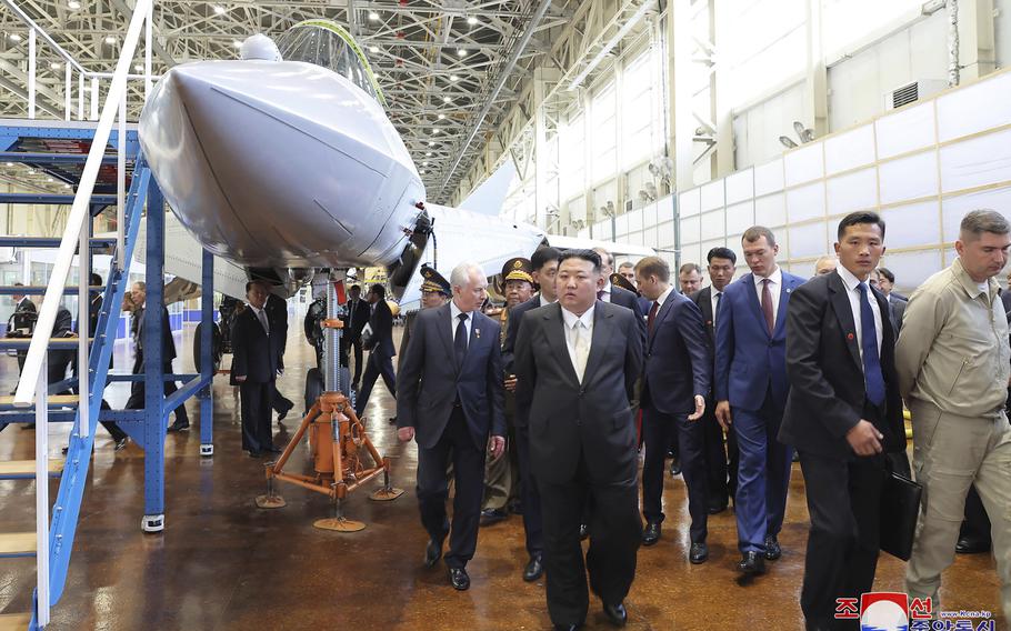 North Korean leader Kim Jong Un, center, visits a Russian aircraft plant that builds fighter jets in Komsomolsk-on-Amur, about 3,900 miles east of Moscow, Friday, Sept. 15, 2023. A dormant North Korean port near the border with Russia appears to have sprung back to life in October.