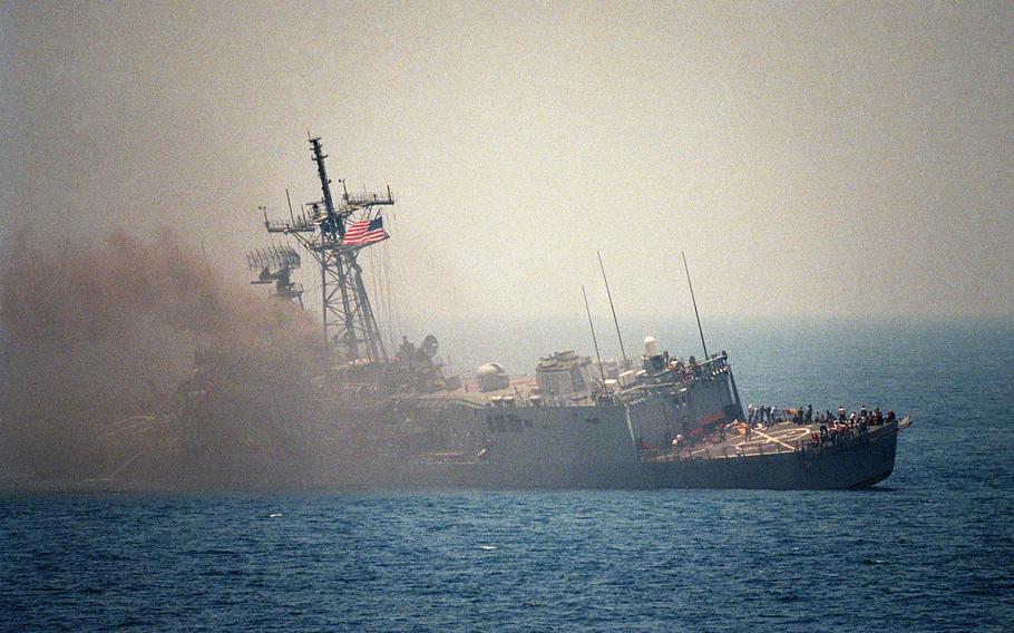 The guided missile frigate USS Stark listing to port after being struck by an Iraqi-launched Exocet missile May 18, 1987.