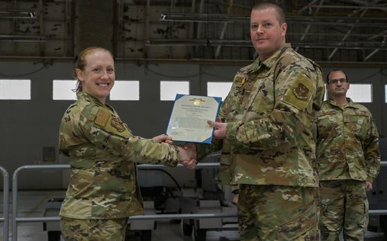 U.S. Air Force Col. Frances Dixon, (left), Commander of the 914th Air Refueling Wing Maintenance Squadron, presents the Air and Space Commendation Medal to U.S. Air Force Staff Sgt. Steve Skelton for his heroic actions on Jan. 12th, 2025. Skelton administered life saving first aid to two women after they fell down an escalator at a local establishment and helped stabilize their condition until they reached further care. (U.S. Air Force photo by Senior Airman Anthony Reyes)