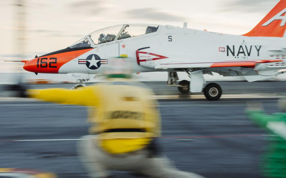 A T-45C Goshawk training jet takes off from the aircraft carrier USS George Washington in October 2023 in the Atlantic Ocean. Some Goshawks resumed flying July 24, 2024, following a two-week safety pause in the fleet,  the Navy said in a statement this week.