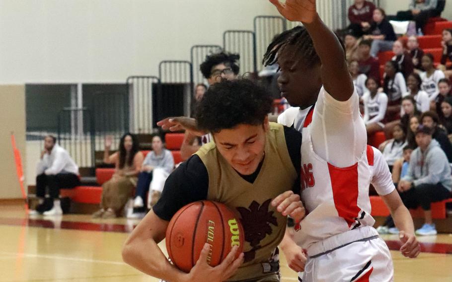 Matthew C. Perry's Jordan Burford bangs into E.J. King's Jeremy Philips; Burford was called for an offensive foul on the play.