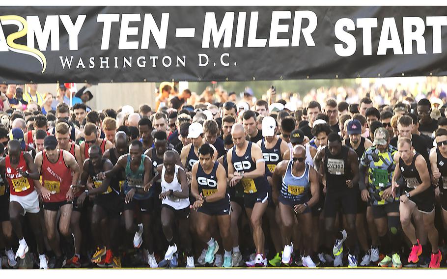 Group of runners take off running from the start line