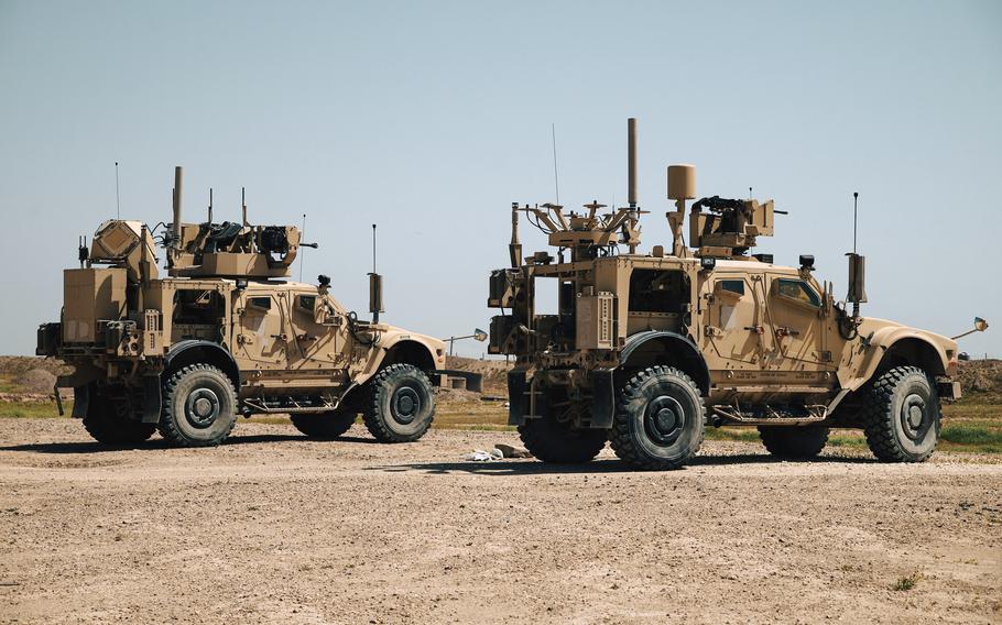 U.S. soldiers ride combat vehicles during an exercise in Syria in April 2024.