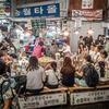 Customers eat at a food stand inside Gwangjang Market in Seoul, South Korea, Sept. 19, 2024. 