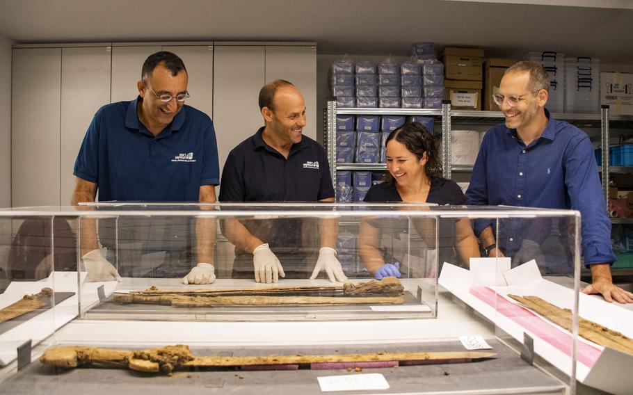 Four “excellently preserved” Roman-era swords were found in a cave overlooking the Dead Sea. From right to left: Dr. Asaf Gayer, Oriya Amichay, Dr. Eitan Klein and Amir Ganor. 