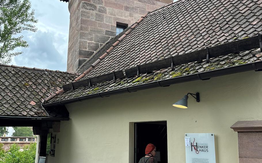 A visitor enters the Henkerhaus in Nuremberg, Germany, on July 7, 2024. The building once served as the house of the city's executioners. It was later turned into a museum.