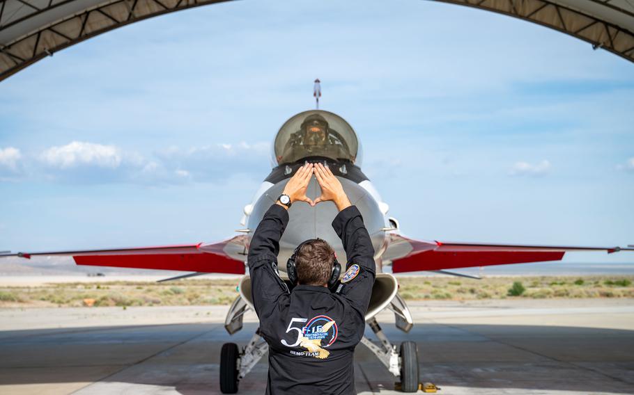 U.S. Air Force Senior Airman Carter Pals, F-16 Viper Demonstration Team dedicated crew chief, performs a show recovery at Edwards Air Force Base, Calif., May 13, 2024. 