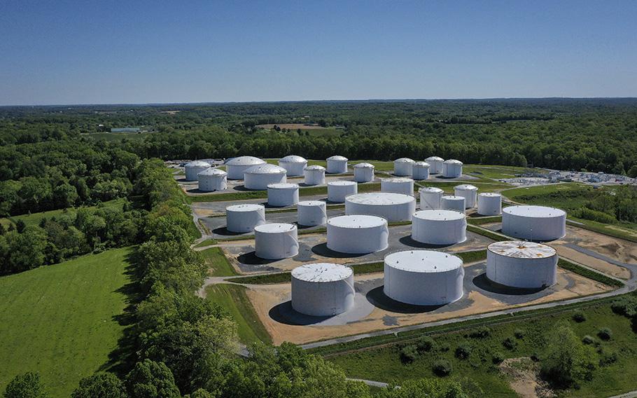 An aerial view shows fuel holding tanks at Colonial Pipeline’s Dorsey Junction Station on May 13, 2021, in Woodbine, Maryland, where gas supply operations to the eastern United States were disrupted for days following a cyberattack.