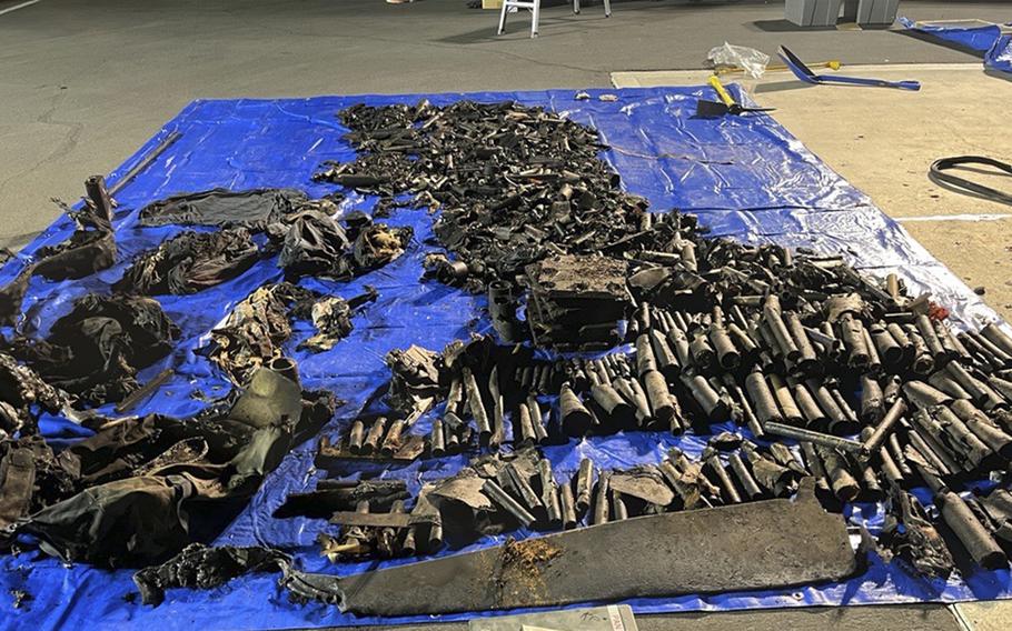 Some of what was found inside the truck placed on a blue tarp.