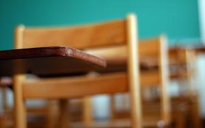 Empty desks in a classroom.