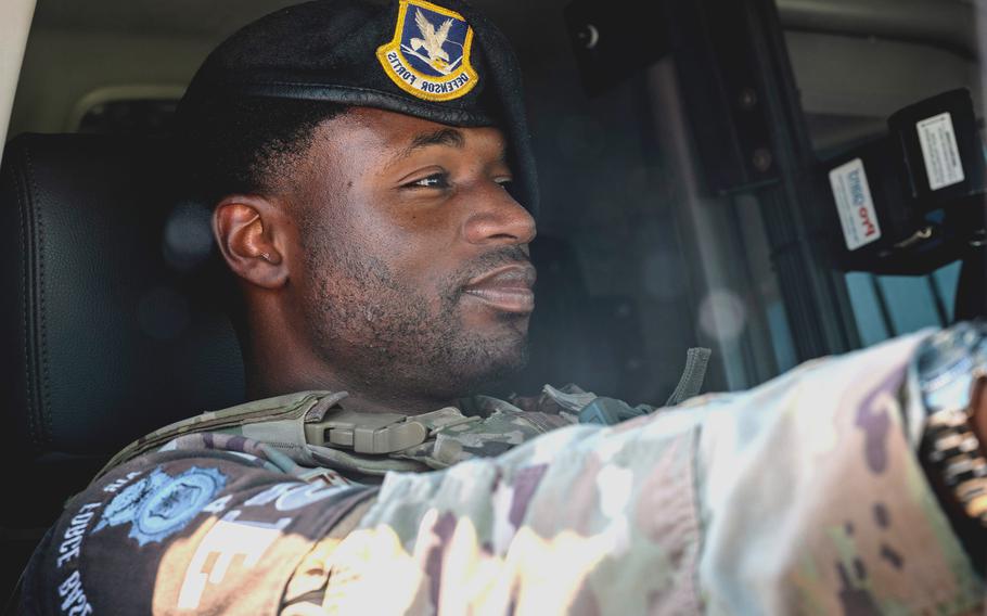 An Air Force Security Forces Airman in a patrol vehicle.