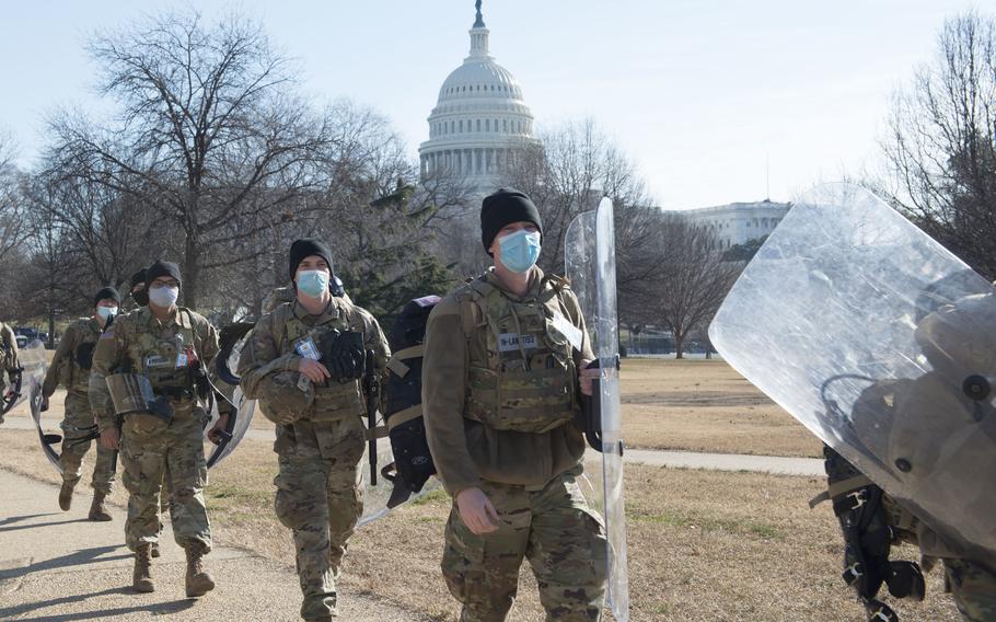 Soldiers with Delta Company, 1st Battalion, 293rd Infantry Regiment of the Indiana National Guard provide security near the Capitol on Jan. 21 in Washington. 