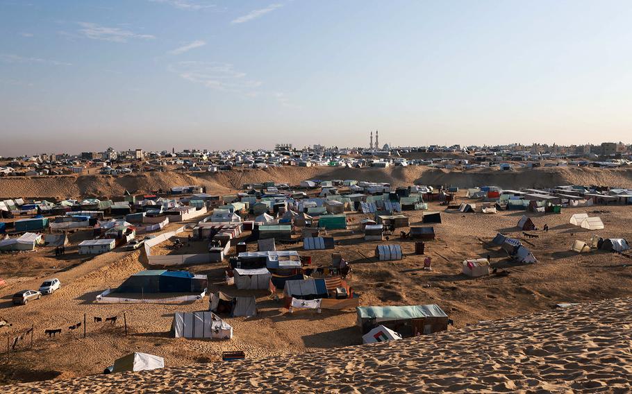 Displaced Palestinians take shelter in a makeshift tent camp by the beach in Rafah near the border with Egypt in the southern Gaza Strip on Jan. 16, 2024.