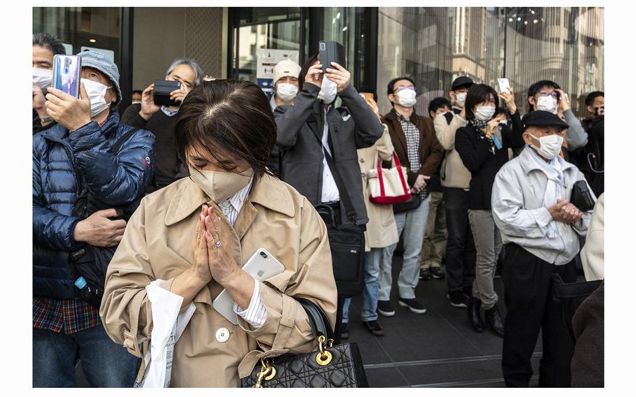 In memory of earthquake and tsunami victims, people take part in silent prayers in Tokyo on March 11, 2022, on the 11th anniversary of the 9.0 magnitude earthquake which triggered a tsunami and nuclear disaster. 