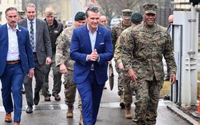 Defense Secretary Pete Hegseth walks with Gen. Michael Langley, commander of U.S. Africa Command, following a town hall meeting at AFRICOM headquarters in Stuttgart, Germany, Feb. 11, 2025.