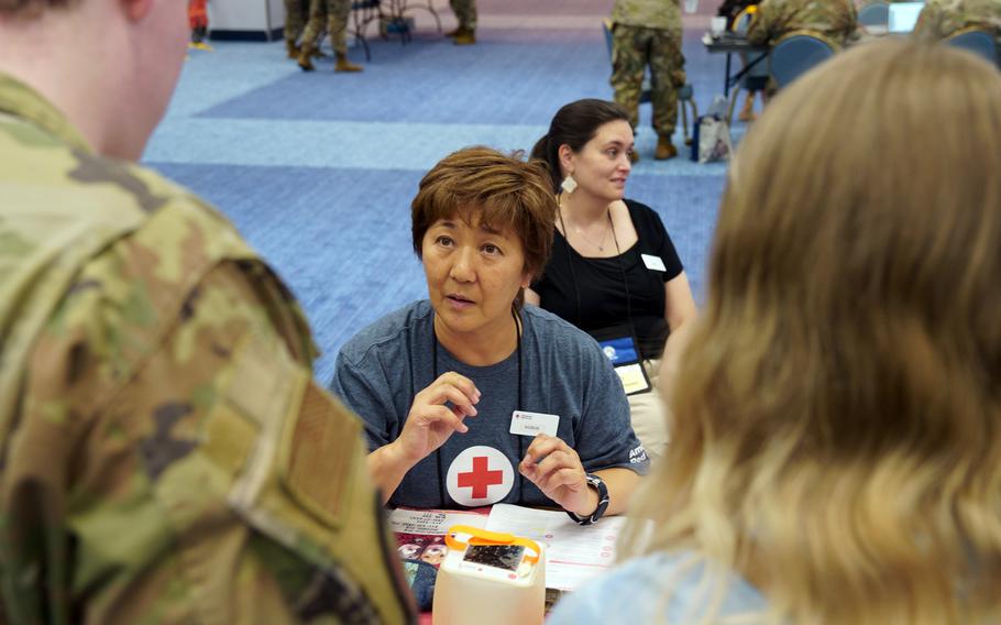 Service members and their families take part in an evacuation exercise at Yokota Air Base, Japan, Thursday, Sept. 7, 2023.