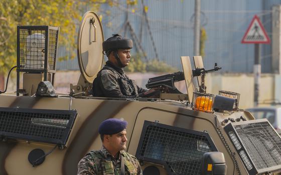 Indian paramilitary soldiers guard at the site of grenade explosion at a marketplace in Srinagar, Indian controlled Kashmir,Sunday, Nov. 3, 2024. An assailant threw a grenade at a marketplace bustling with shoppers in the main city of Indian-controlled Kashmir on Sunday, wounding at least nine people, police said. (AP Photo/Mukhtar Khan)