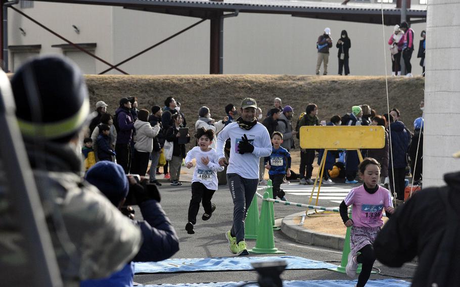 Runners crossing the finish line of a race.