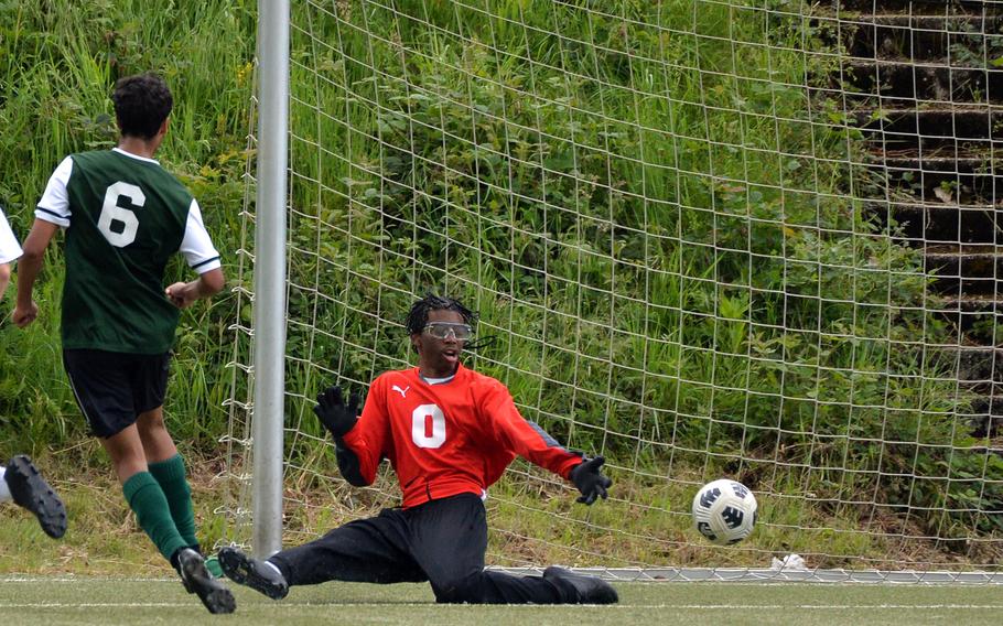 Jens Muller scores an AFNORTH goal past Spangdahlem keeper Isaiah Riley in the Lions’ 4-0 win in a Division III semifinal at the DODEA-Europe soccer finals in Landstuhl, Germany, May 22, 2024. AFNORTH will play Ansbach Thursday for the DIII title.