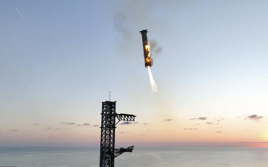 SpaceX’s mega rocket booster returns to the launch pad to be captured.