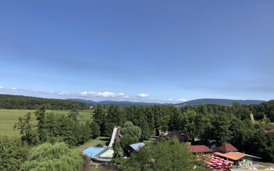 A view of Didiland in Alsace, France, from the Ferris wheel. The Wild River ride is to the left and a restaurant and eating area are to the right.