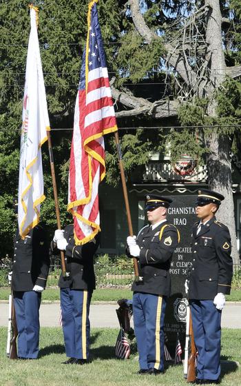 The Illinois Army National Guard Funeral and Honors Team presents the flag during a ceremony on July 6, 2024, as a section of State Highway 133 through Oakland, Ill., was named the 1st Lt. Jared W. Southworth Highway. 