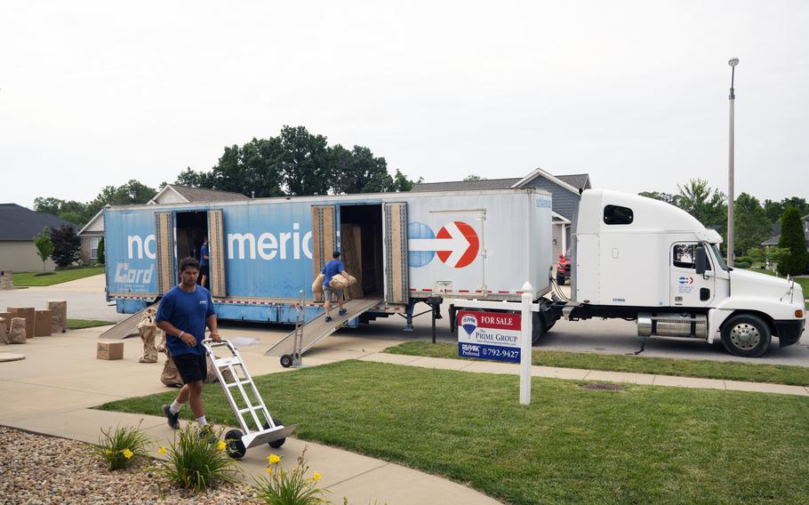 Movers pack a military member’s property into boxes and load them into crates to be transferred to a temporary storage facility in O’Fallon, Ill., July 1, 2019. The Army is replacing a years-old policy that allowed soldiers who are sent on deployment to store personal items — such as vehicles — at no cost while they’re gone, the service said.