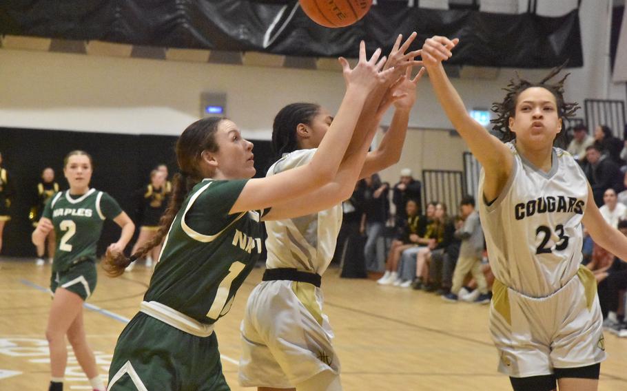 Trishauna Lewis taps the ball away.