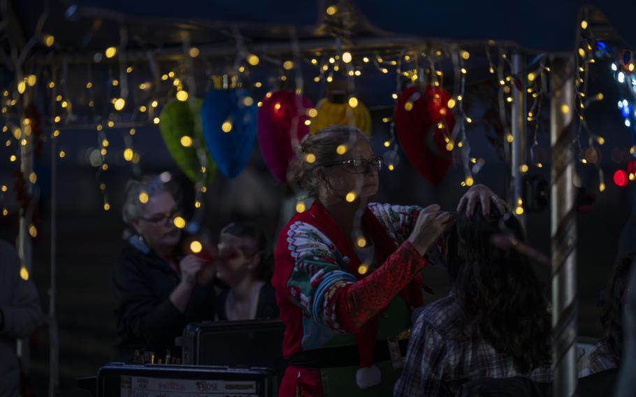 Yellow Christmas lights illuminate the MacWonderland holiday festival at MacDill Air Force Base.