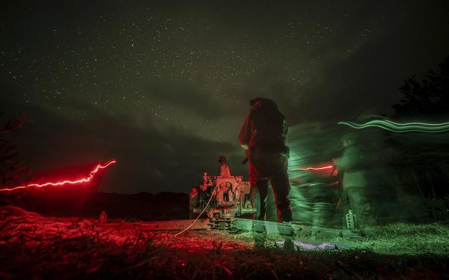 Ukraine troops prepare to fire artillery at Russian positions.