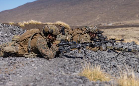 3rd Littoral Combat Team Marines aim their rifles as part of a security detail at Pohakuloa Training Area, Hawaii.