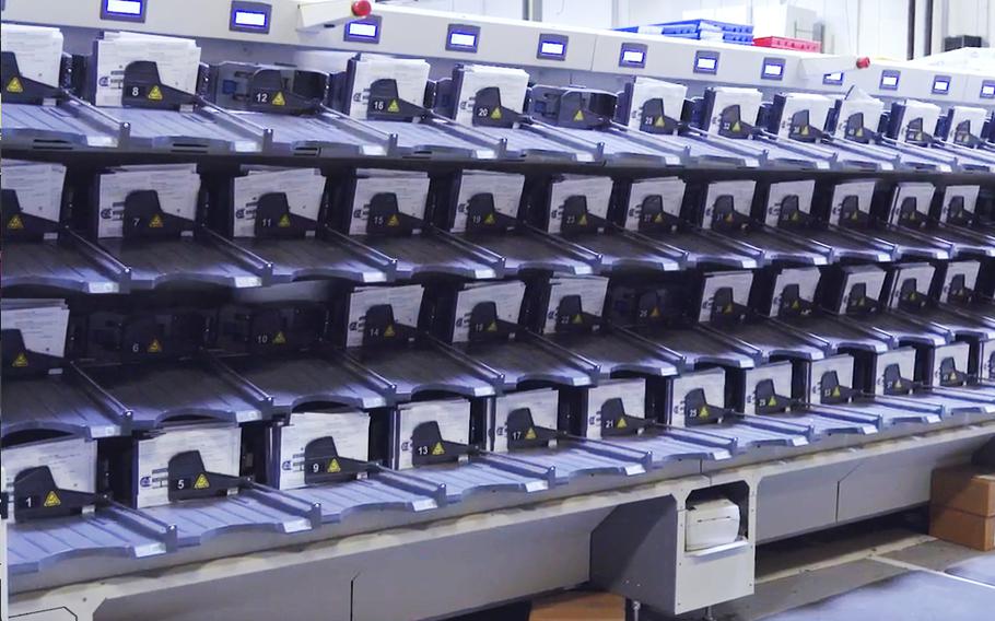 A demonstration of a ballot-sorting machine used to count mail-in votes in Philadelphia.